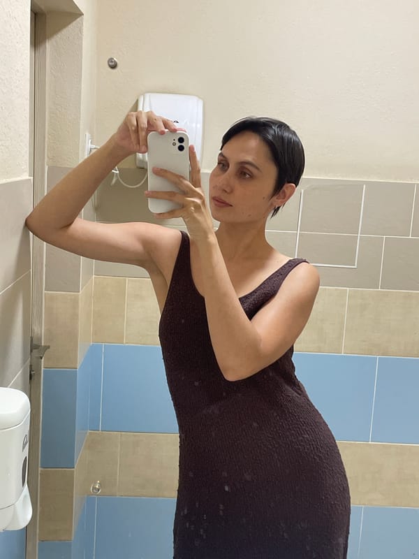 Woman takes selfies in brown dress, Izhevsk Russia