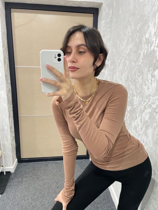 Woman takes mirror selfie in Izhevsk early morning