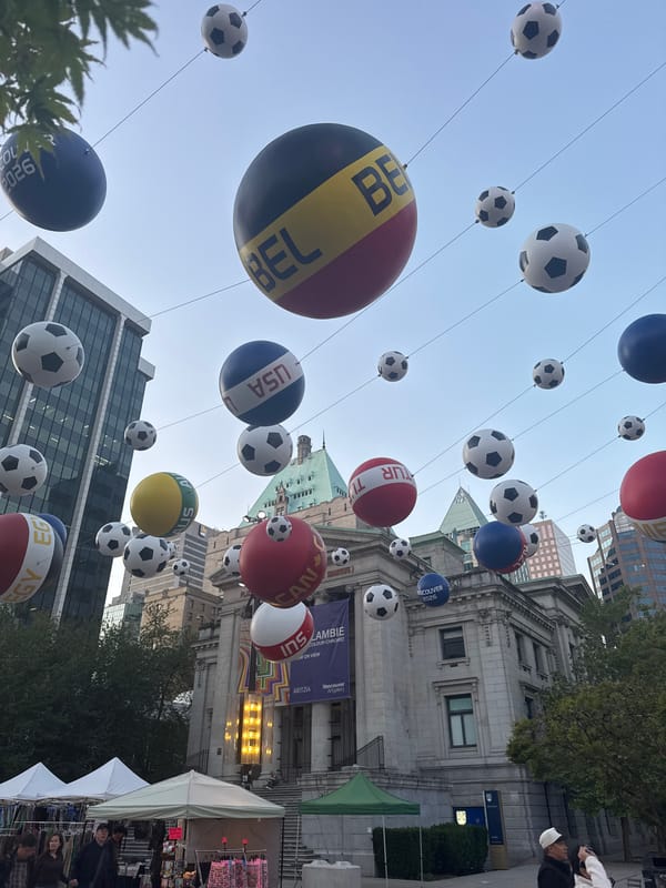 Soccer ball country display suspended over Vancouver street