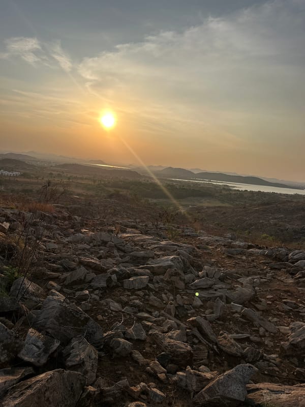 Sunset landscape captured over mountains and water in Puttaparthi