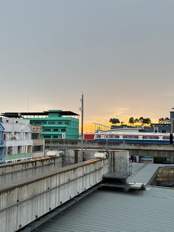 Elevated rail line at dusk in Samrong Nuea, Thailand