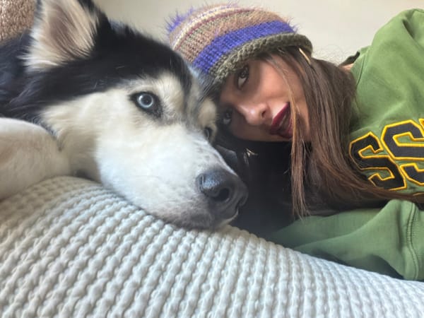 Woman and husky share quiet moment indoors in Tel-Aviv
