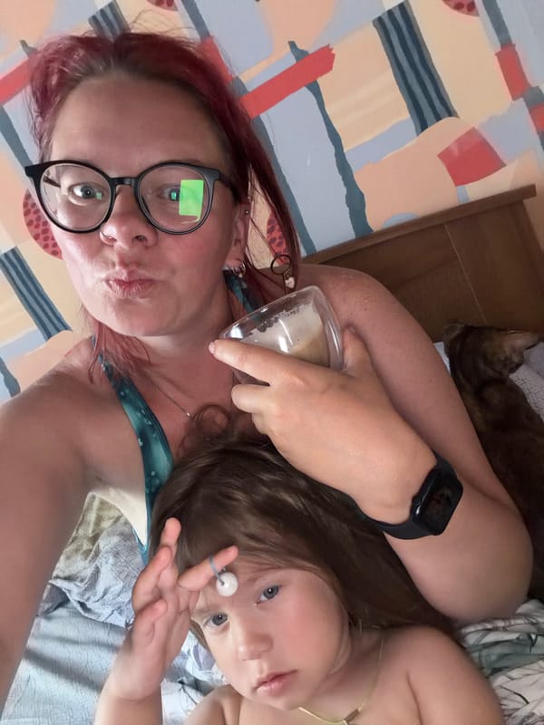 Woman and child share bedtime moment in selfie