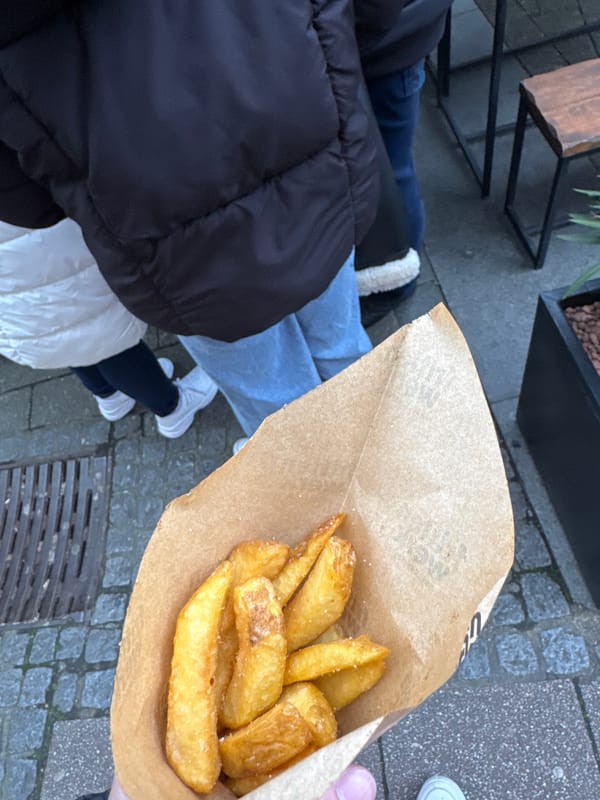 Midday street life documented around Essen's Market Church square