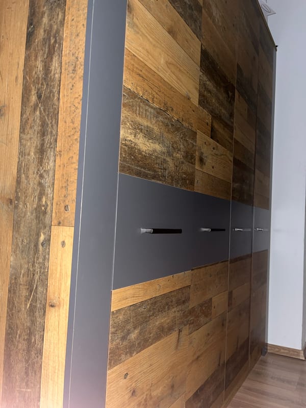 Close-up documentation of wooden surface with metal fixture captured