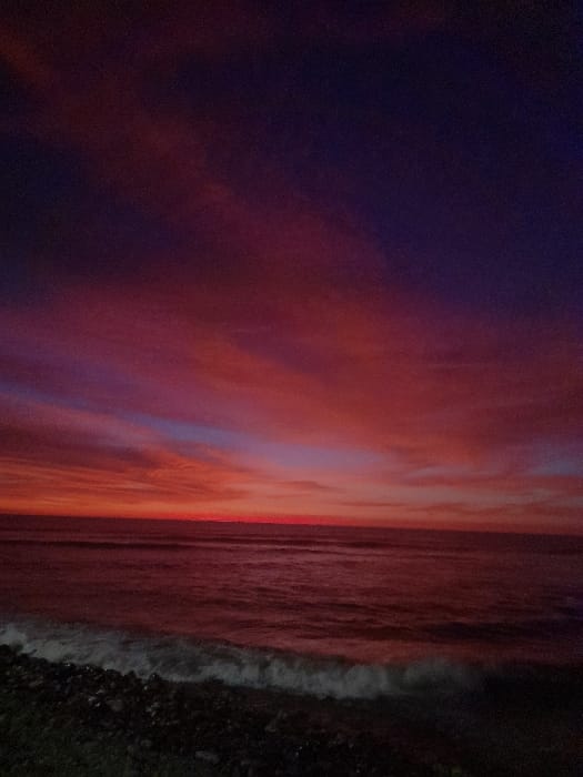 Vibrant sunset captured over ocean in Huanchaco, Peru