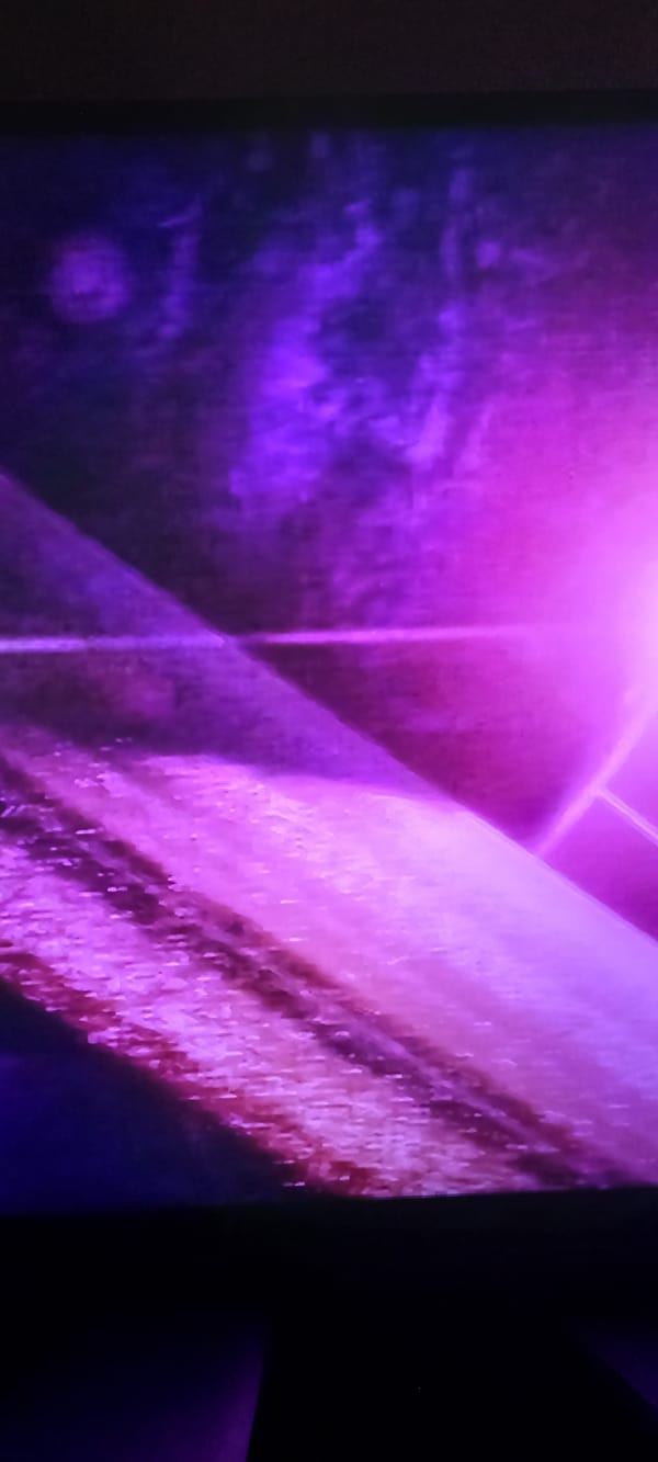 Purple-toned cosmic abstracts meet a rustic mountain cabin