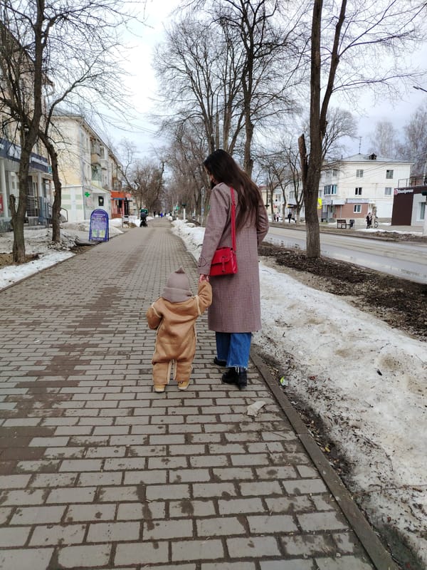 Mother and child navigate city via walking and public transit