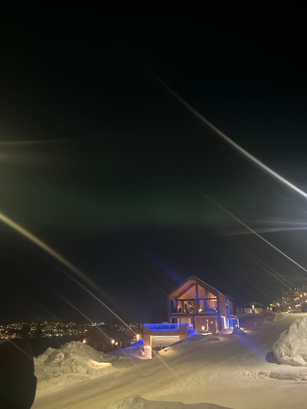Aurora Borealis illuminates winter sky over Tromsø, Norway