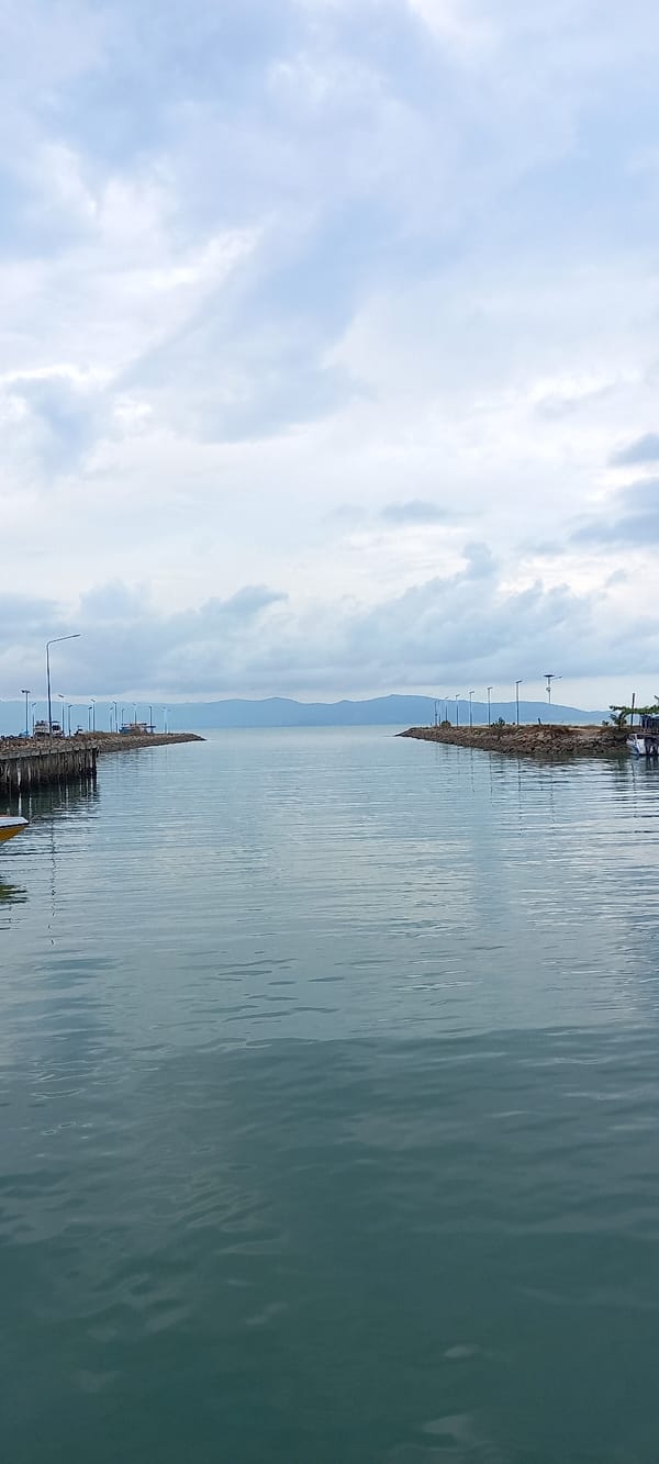 Overcast morning at Baan Tai marina with docked boats