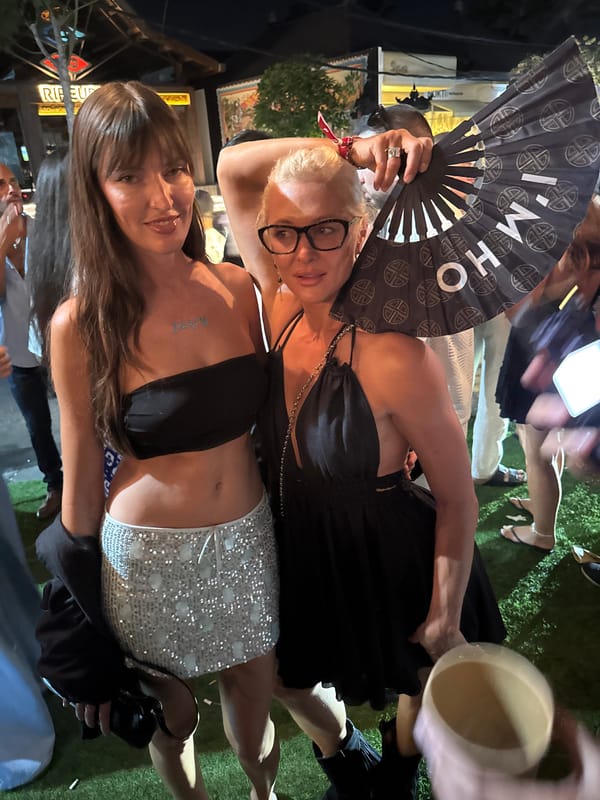Night out at an outdoor party with DJ and dressed-up crowd