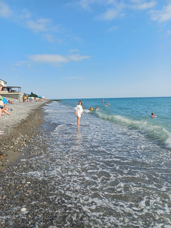 Sochi beach day: swimming, sunbathing, and parasailing on the Black Sea