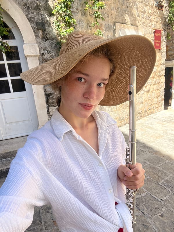 Street musician performs flute in Budva squares