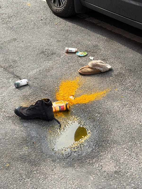 Items scattered on New York street near vehicle