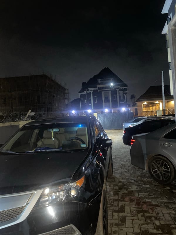 Late-night arrival at a residential building in Abuja