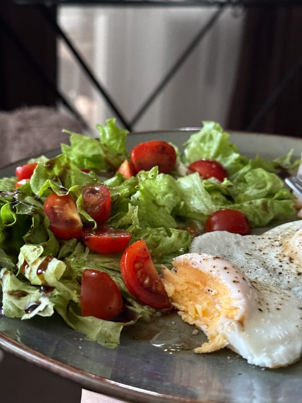 Salad with tomatoes and egg photographed in Krasnoyarsk