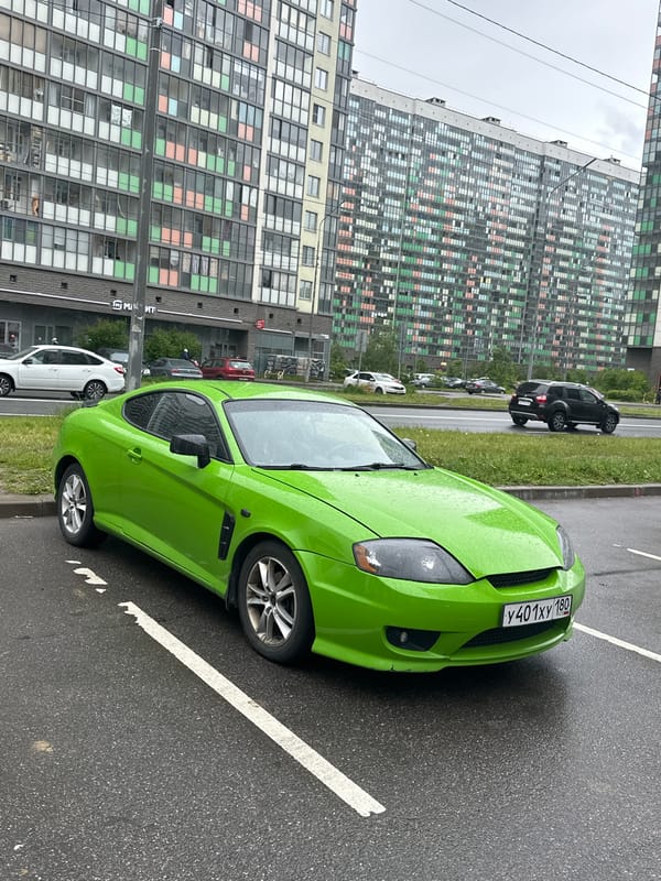 Vehicles parked on wet streets in Murino, Russia