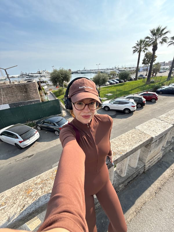 Woman in brown athletic wear photographed on Sanremo steps