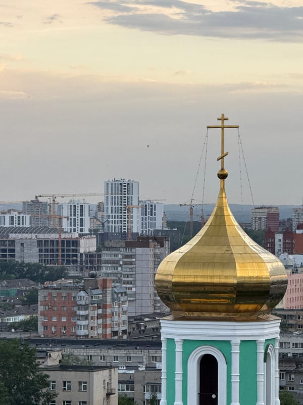 Rooftop photography session captures Perm cityscape and Orthodox churches