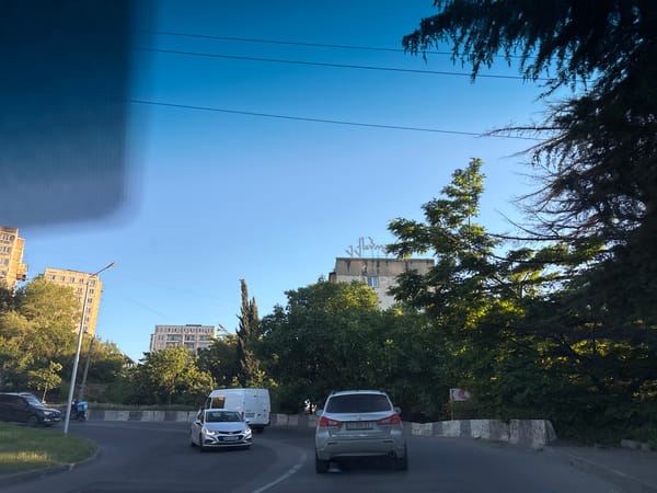 Routine street scenes documented during afternoon drive through Tbilisi
