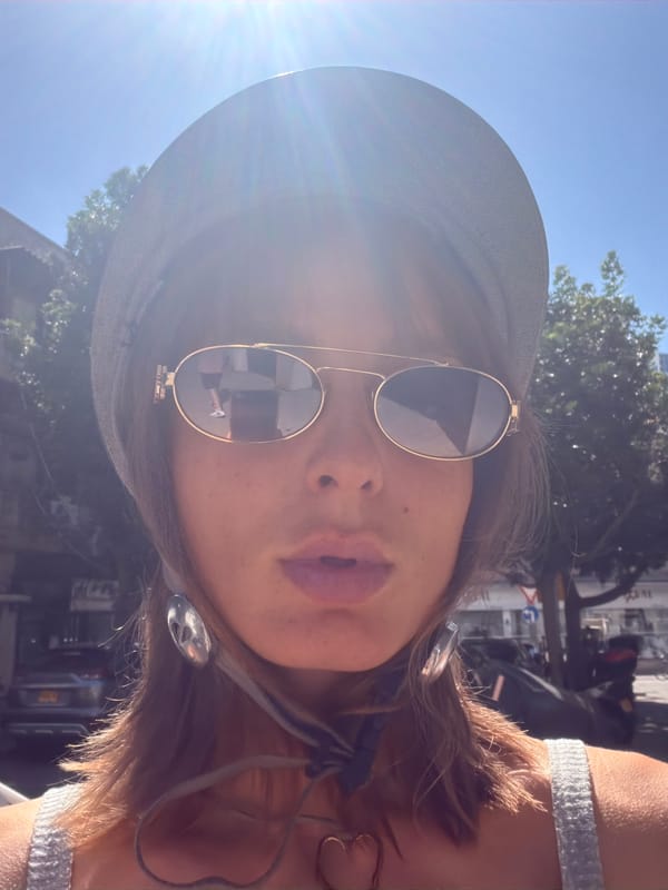 Helmet selfie and fresh delphiniums in Tel Aviv