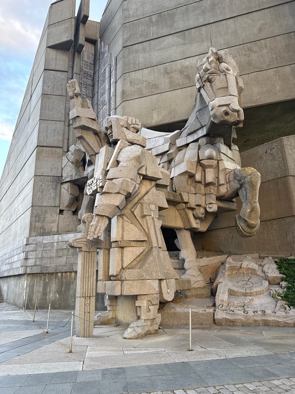 Visitor documents Bulgaria's monumental socialist-era memorial complex at sunset