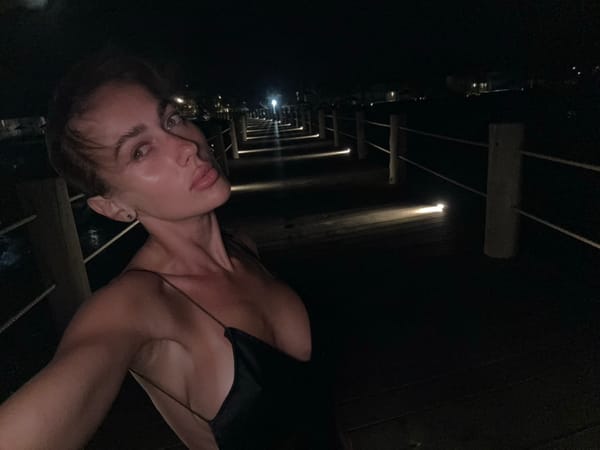 Woman enjoys seafood dinner and pier walk in Zanzibar