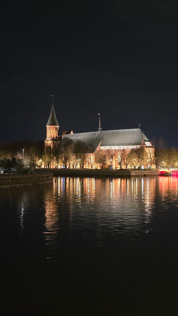 Kaliningrad Cathedral photographed at night reflecting in Pregel River