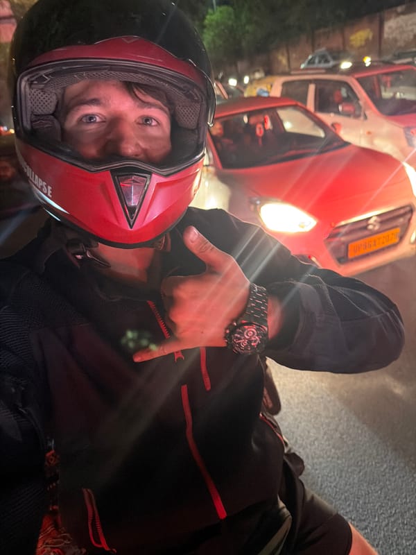 Nighttime motorcycle ride through Delhi traffic