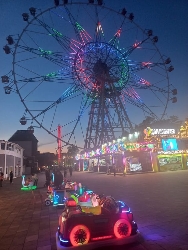Families enjoy evening at illuminated Sochi amusement park