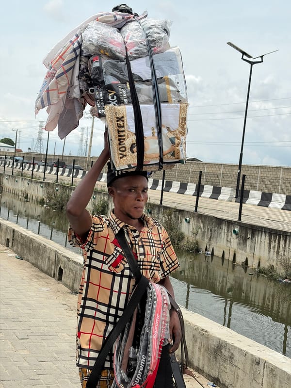 Everyday street activity in Igboefon, Lagos midday
