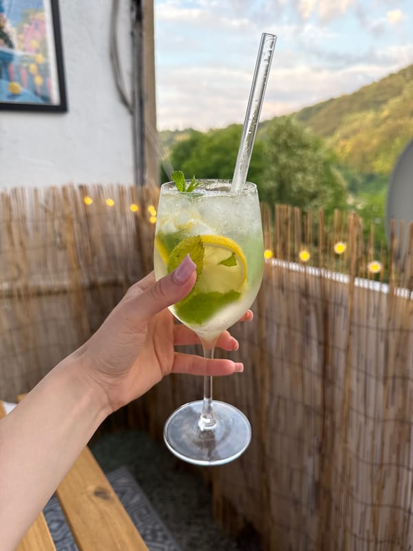 Iced lemon mint drink, held close, two angles