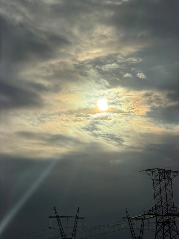 Rainy highway drive, stormy skies, and a quiet moment with a drink