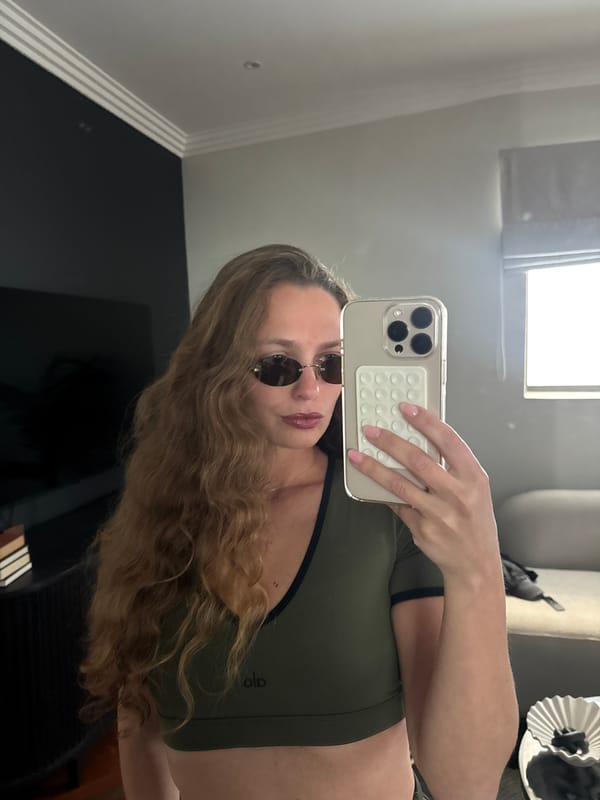 Woman takes mirror selfies in athletic wear, Cape Town