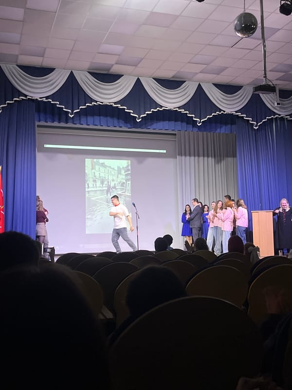 Presentation ceremony held at Vsevolozhsk auditorium with speakers and slideshow