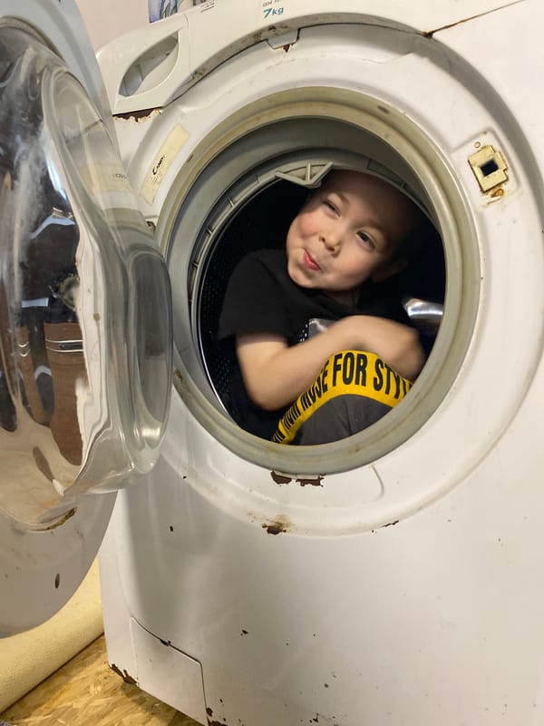 Child plays inside washing machine drum in Noviy, Russia