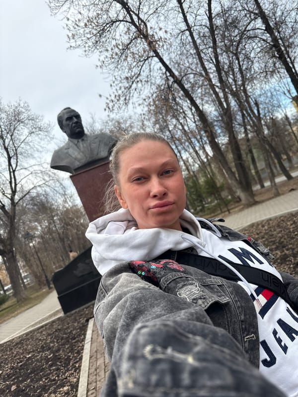 Woman takes selfie at monument in Perm, Russia