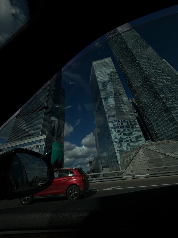 Rolling past Moscow-City's glass towers on a clear afternoon