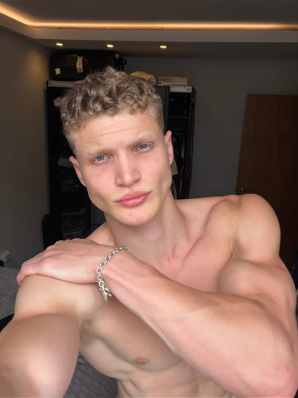 Shirtless blonde man spotted at London jewelry display