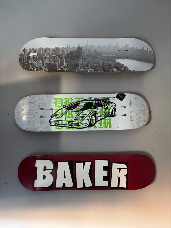Decorative skateboards mounted on wall in East Suffolk