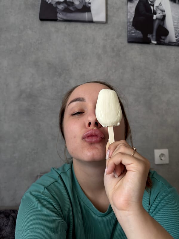 Woman enjoys popsicle in early morning Chaikovsky selfie session