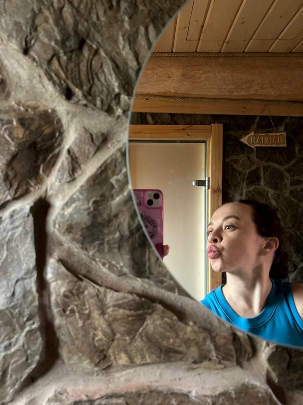 Woman takes selfie in stone-featured restroom in Novyi, Russia