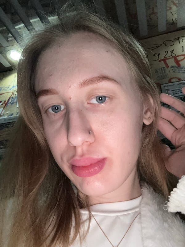 Woman takes selfie in Koysugskiy, Russia early morning