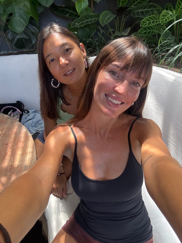 Two women take selfie outdoors in Kuta Selatan