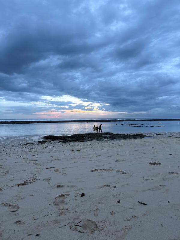Beach visitor enjoys quiet morning under dramatic skies