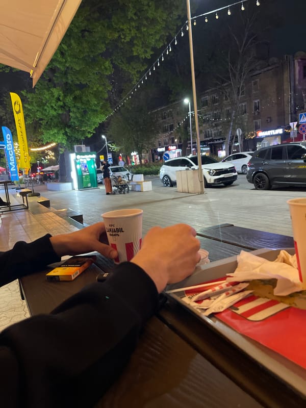 Customer enjoys KFC meal outdoors in Tashkent