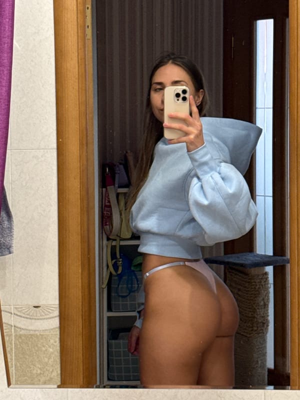 Woman takes mirror selfie in Zanevka, Russia