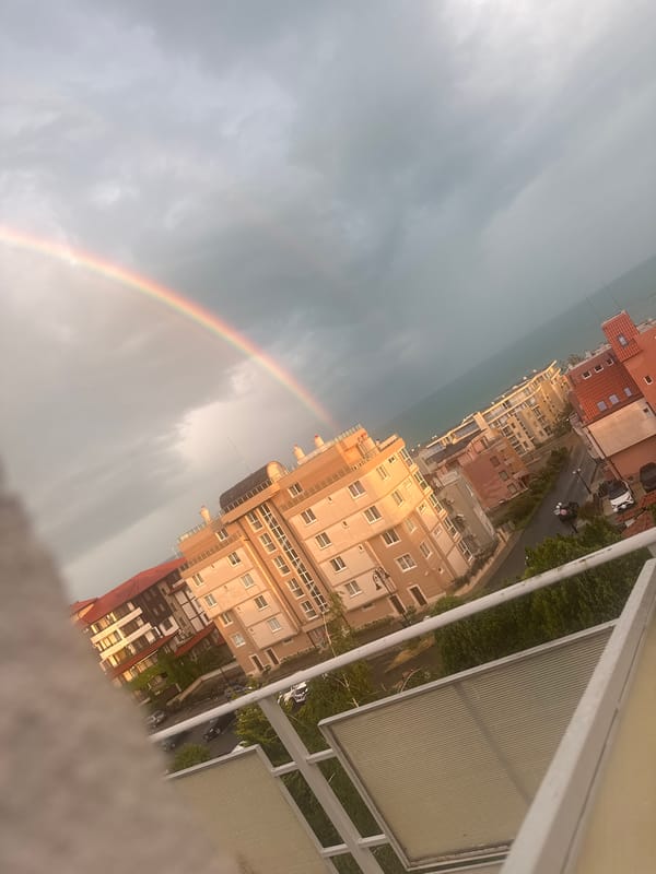 Rainbow appears over Sveti Vlas, Bulgaria residential district