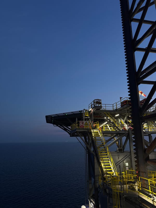 Offshore oil rig at sea, day and golden hour views