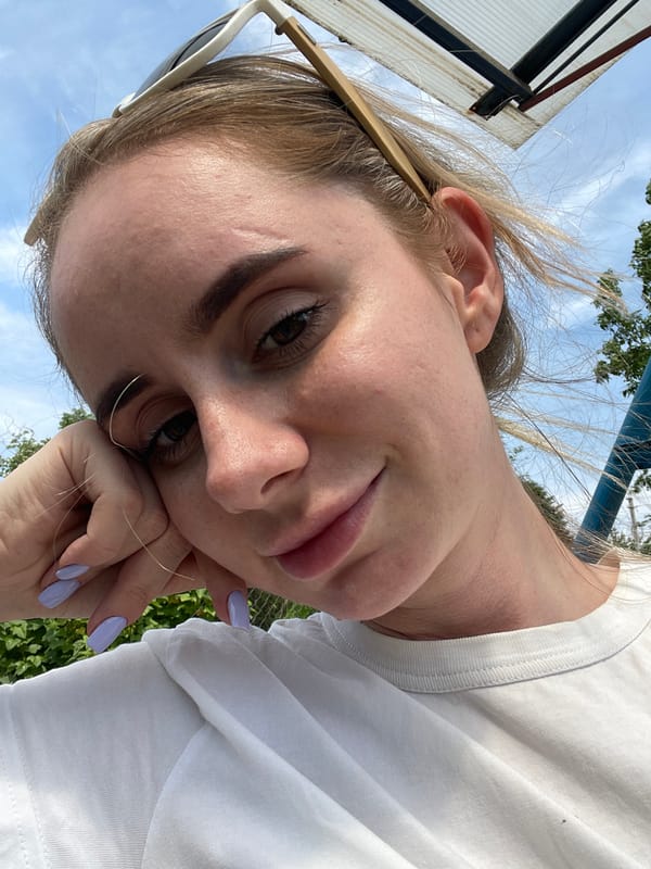 Woman takes outdoor selfies in Yasnoe, Russia